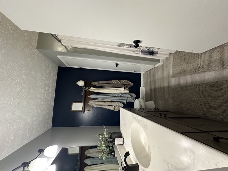 Full bath with navy accents